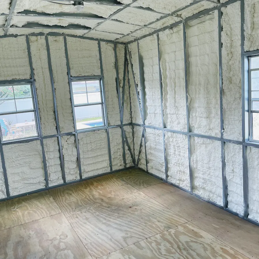 Closed-cell spray foam insulation applied to wall cavities in a residential project in Pennfield